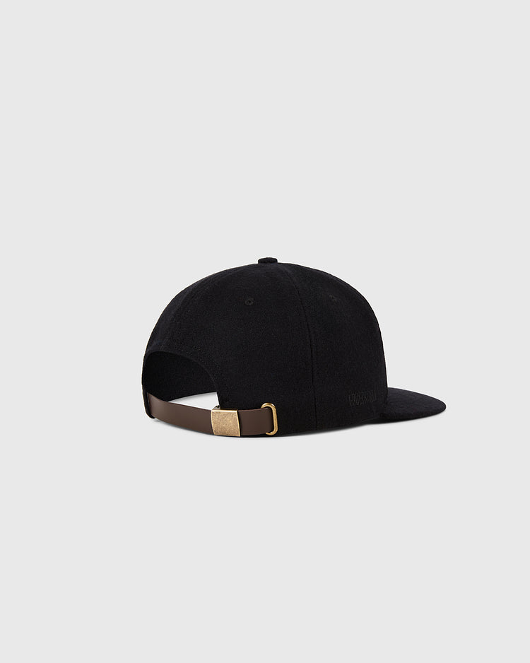 The Ebbets Field Baltimore Orioles 1954 MLB Authentic Wool Ballcap is shown from the back, with a dark brown adjustable strap and brass buckle, set against a light gray background. Part of the Decade of Change Collection.