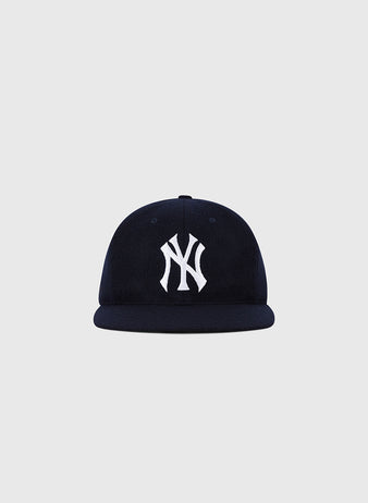 The Ebbets Field New York Yankees 1961 MLB Authentic Wool Ballcap features a navy blue design with a white NY logo, inspired by the original team cap and shown on a plain light grey background.