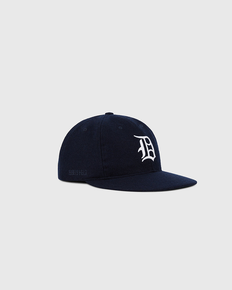 The Ebbets Field Detroit Tigers 1958 MLB Authentic Wool Ballcap in navy features a white embroidered 'D' on the front, displayed against a plain light gray background.