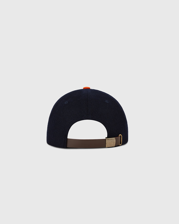 The Ebbets Field Houston Colt .45s 1962 MLB Authentic Wool Ballcap, navy blue, is shown from the back with a brown adjustable strap, brass buckle, and small red button on top against a plain light gray background.
