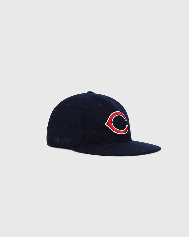 The Ebbets Field Cleveland Indians 1958-1961 MLB Authentic Wool Ballcap features a navy blue vintage design with a red and white 