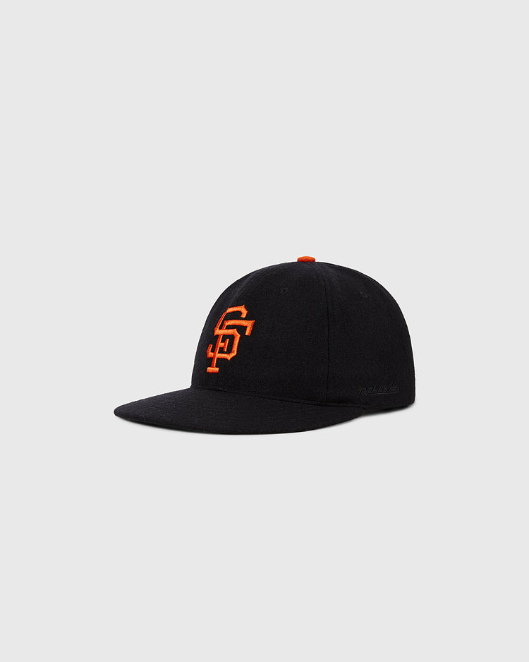 The San Francisco Giants 1958 MLB Authentic Wool Ballcap by Ebbets Field features a black design with an orange SF logo, part of the Decade of Change Collection, and is shown on a plain light gray background.