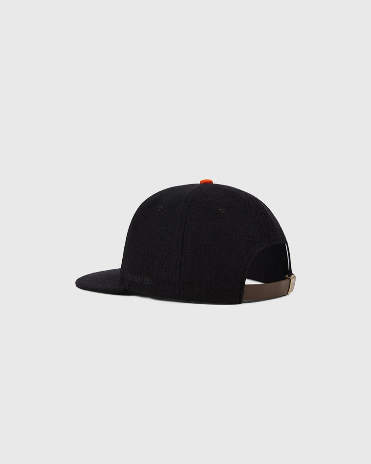 The Ebbets Field San Francisco Giants 1958 MLB Authentic Wool Ballcap, shown from the back-left, features a brown adjustable strap and orange top button, set against a plain light gray background.