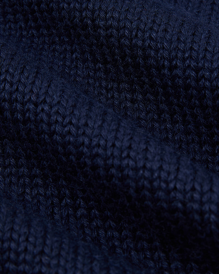 Close-up of the EFF Chicago Cubs 1911 Wool Shawl Collar Sweater in dark blue, featuring textured knitted stitches and soft, wavy folds that evoke the classic 1911 team style.