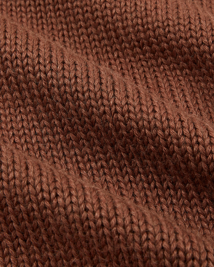Close-up of the EFF St. Louis Browns 1909 Wool Cardigan Sweater, showing brown knitted wool with visible ribbed texture and soft, wavy folds, evoking the classic 1909 style.