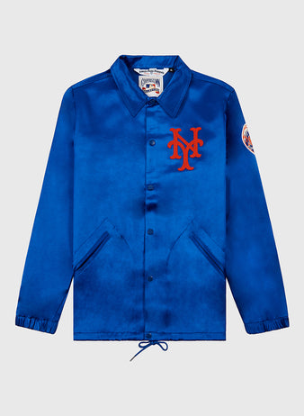 The EFF New York Mets 1969 Satin Windbreaker Jacket is a royal blue coach jacket with snap buttons, side pockets, a red NY logo on the chest, Mets patch on the sleeve, and drawstring hem—ideal for Miracle Mets fans.
