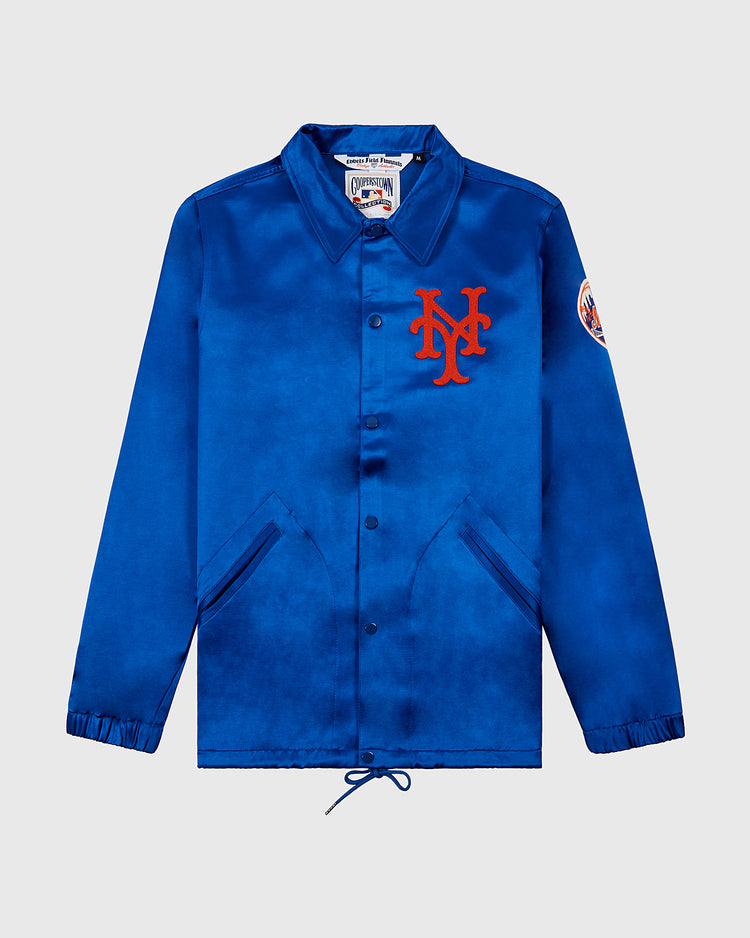The EFF New York Mets 1969 Satin Windbreaker Jacket is a royal blue coach jacket with snap buttons, side pockets, a red NY logo on the chest, Mets patch on the sleeve, and drawstring hem—ideal for Miracle Mets fans.