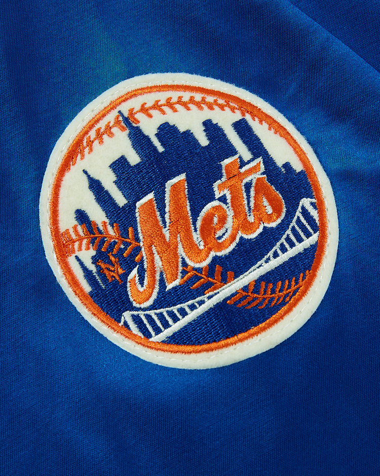 The EFF New York Mets 1969 Satin Windbreaker Jacket features an embroidered logo with orange script, city skyline, orange stitching, and a white bridge on blue—ideal for fans of vintage Mets style.