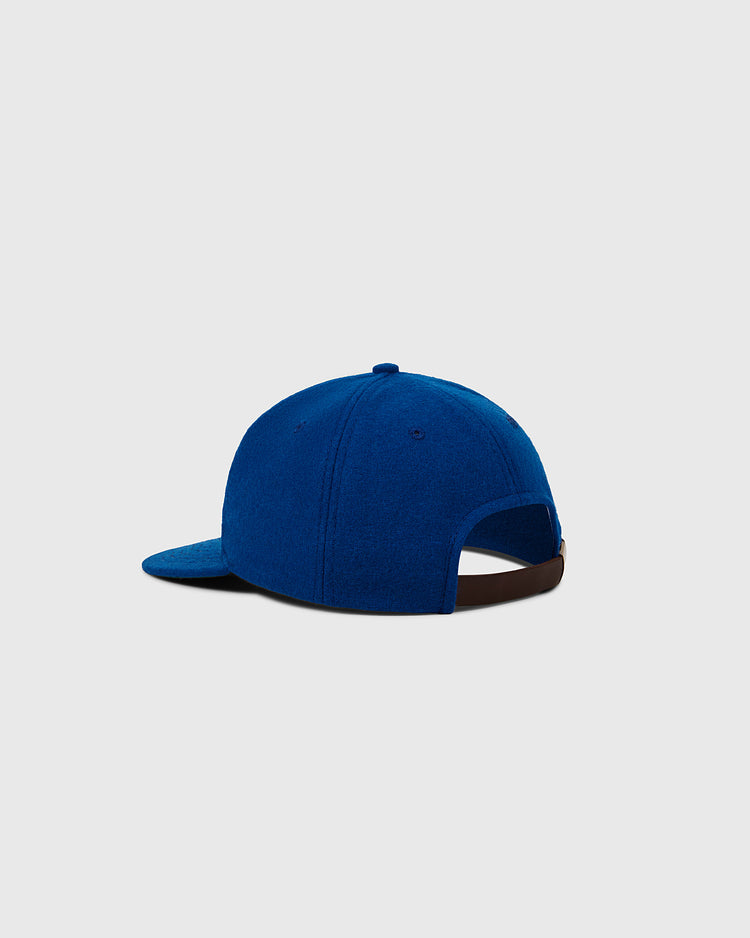 The EFF Fort Worth Cats 1959 Authentic Wool Ballcap is blue with a curved brim, an adjustable brown strap, and a plain light gray background—a classic nod to the 1959 Texas League team.