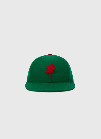 The EFF Oakland Oaks 1939 Authentic Wool Ballcap features a green design with a red maple leaf emblem, inspired by the Pacific Coast League team, and is displayed on a plain light gray background.