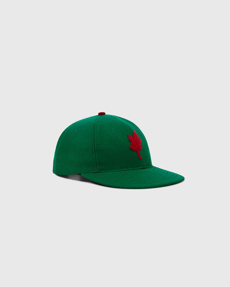 The EFF Oakland Oaks 1939 Authentic Wool Ballcap features a green design with a red maple leaf emblem on the front, inspired by the classic 1939 style and displayed against a plain light gray background.
