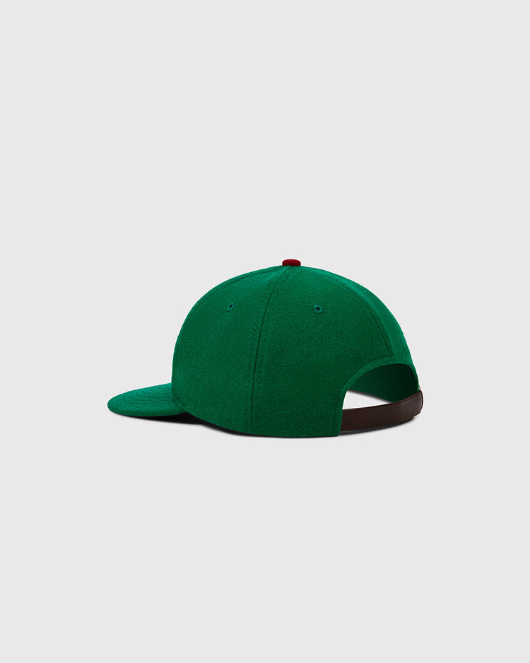 The EFF Oakland Oaks 1939 Authentic Wool Ballcap is green with an adjustable brown strap, a red top button, and a classic design, shown from the back against a plain light gray background.