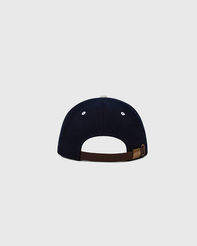 The EFF Los Angeles (PCL) 1954 Authentic Wool Ballcap is shown from the back in navy blue wool, with a brown adjustable strap, metal buckle, two white ventilation holes on each side, and a plain light gray background.