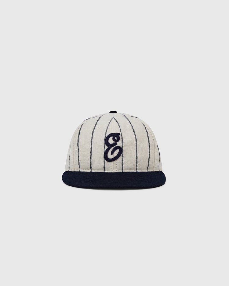 The Ebbets Field Ebbets Felt 'E' Wool Pinstripe Ballcap features cream-colored wool with thin black pinstripes, a black brim, and a stylized black 