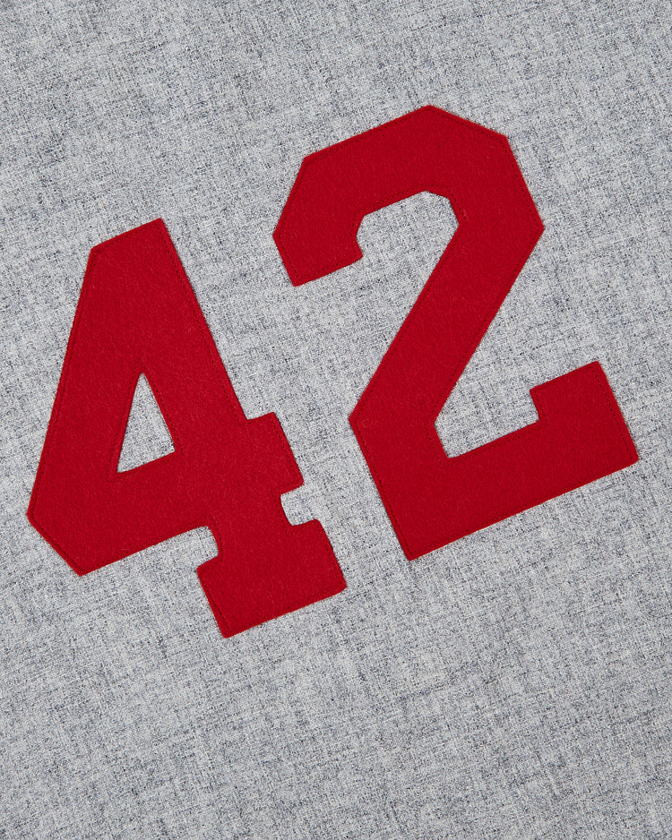 The Ebbets Field Aloha 100th Infantry 1942 Authentic Wool Road Baseball Jersey features a red number 42 on heather gray, inspired by the original Aloha logo and honoring the legacy of the 100th Infantry Battalion.