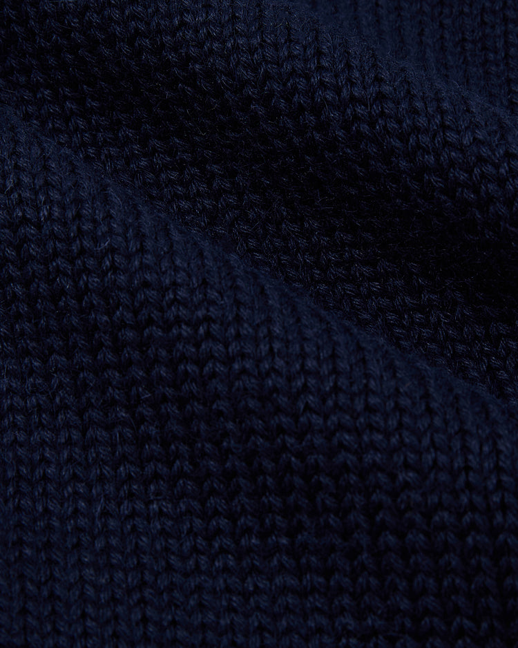 Close-up of the Ebbets Field New York Yankees 1922 Wool Shawl Collar Sweater, highlighting its dark blue ribbed knit texture and soft woven fibers.