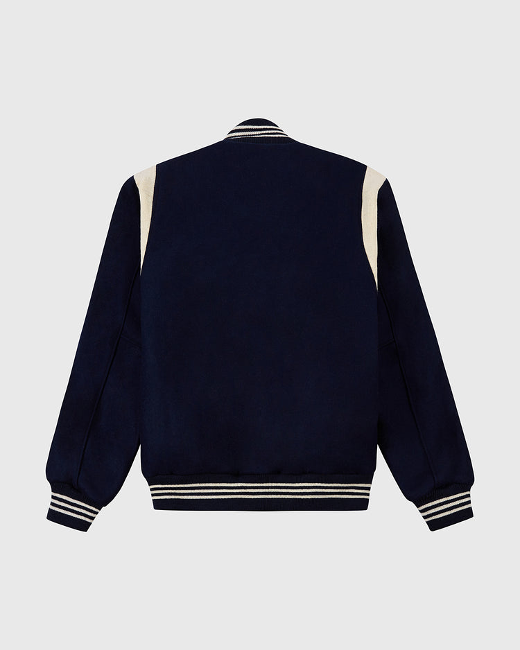 The EFF Chicago White Sox 1967 Authentic All Wool Varsity Jacket features navy blue wool, cream shoulder accents, and striped ribbed cuffs, collar, and hem—shown from the back against a gray background.