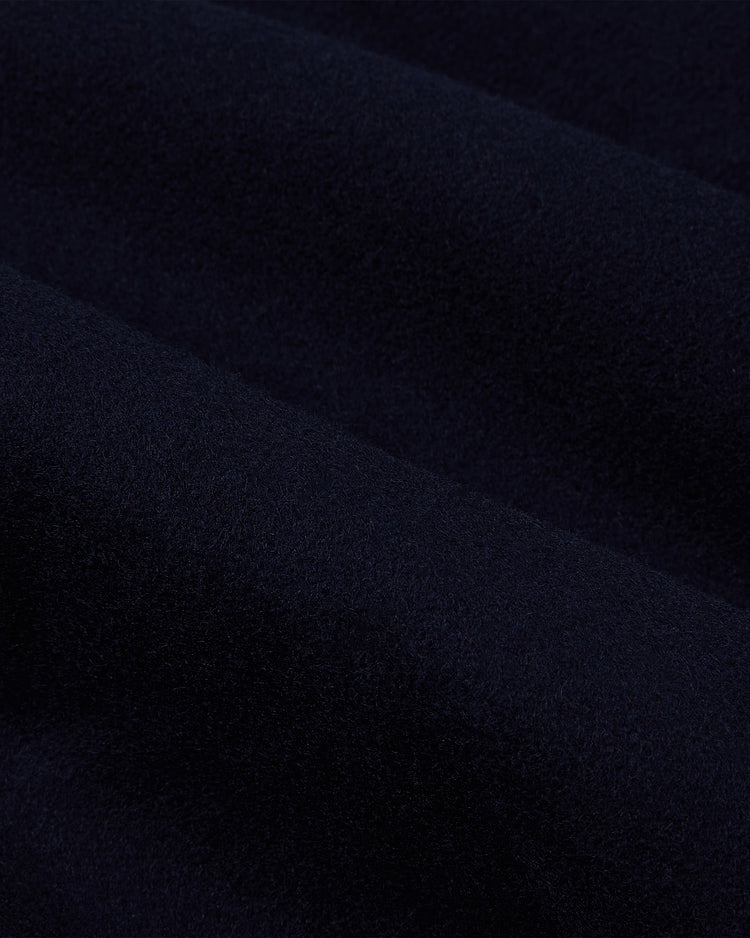 Close-up of dark navy blue, soft wool fabric with velvety folds, just like the premium material in the EFF Chicago White Sox 1967 Authentic All Wool Varsity Jacket.