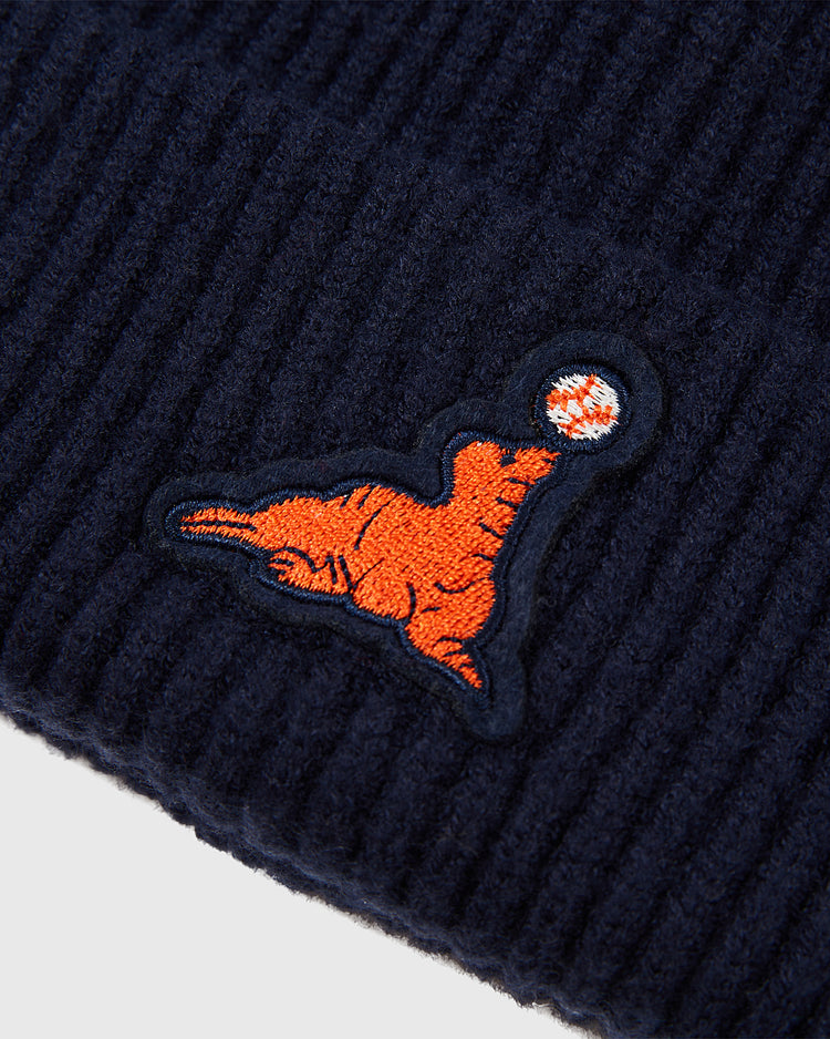 Close-up of the Ebbets Field San Francisco Seals Patch Logo Ribbed Beanie in dark blue, showing ribbed knit fabric and an embroidered orange seal balancing a red and white ball on its nose.