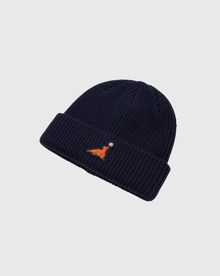 The Ebbets Field San Francisco Seals Patch Logo Ribbed Beanie is dark blue with a folded brim and an orange embroidered sitting tiger on the front, shown against a plain light background.