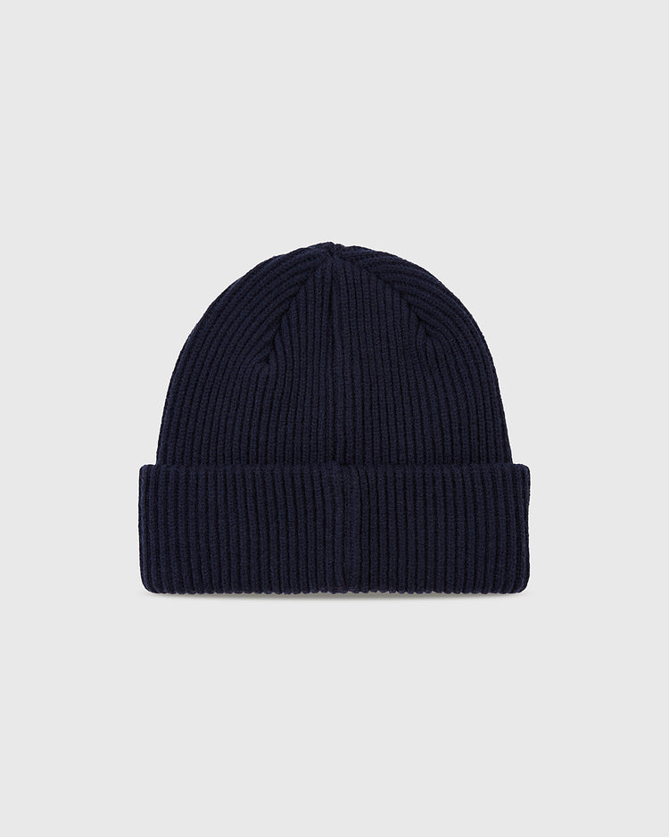 The Ebbets Field Los Angeles Angels (PCL) Patch Logo Ribbed Beanie is navy blue with a folded cuff and patch logo, shown on a plain light gray background.