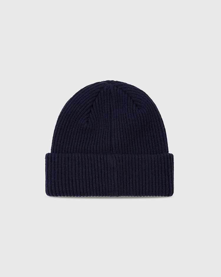 The Ebbets Field Portland Beavers Felt Logo Ribbed Beanie is a navy blue, folded cuff knit hat, ideal for PCL baseball fans, shown on a plain light gray background.