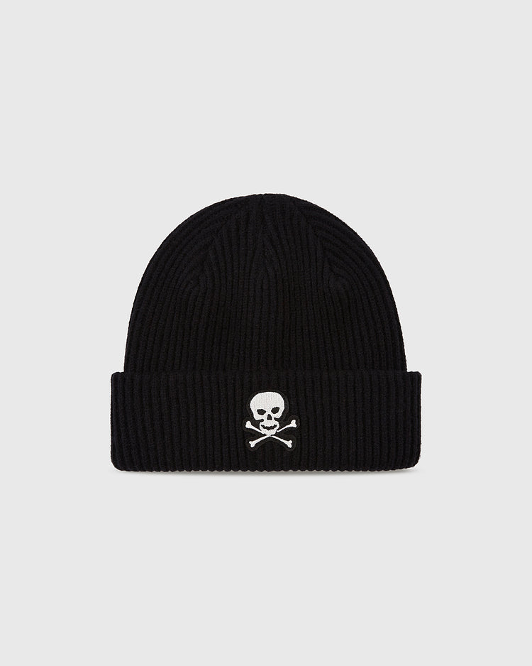 The Ebbets Field Sioux City Ghosts Embroidered Felt Ribbed Beanie is a black acrylic hat with a ribbed knit, folded brim, and white skull and crossbones embroidery on the front, honoring the legendary Sioux City Ghosts.