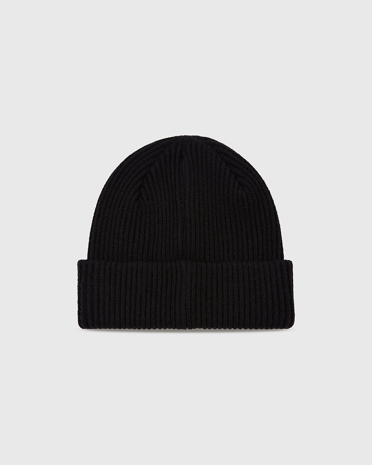 The Ebbets Field Sioux City Ghosts Embroidered Felt Ribbed Beanie in black features a folded brim and bold style, showcased on a plain light gray background.