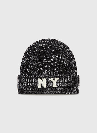 The Ebbets Field New York Black Yankees Felt Logo Ribbed Beanie is a black and white marled knit hat with a folded brim and bold white NY letters, honoring the legacy of the Negro National League team.