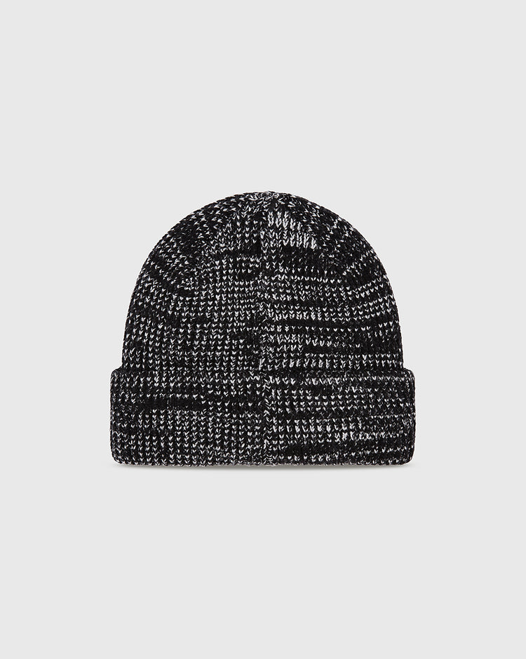 The Ebbets Field New York Black Yankees Felt Logo Ribbed Beanie, in black and white marled knit with a folded cuff, is shown on a plain light grey background.