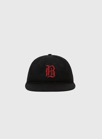 The Ebbets Field Birmingham Black Barons 1951 Cotton Twill Ballcap features a black flat brim and red gothic “B” embroidery, honoring the legendary Negro Leagues team and Satchel Paige, shown on a light gray background.