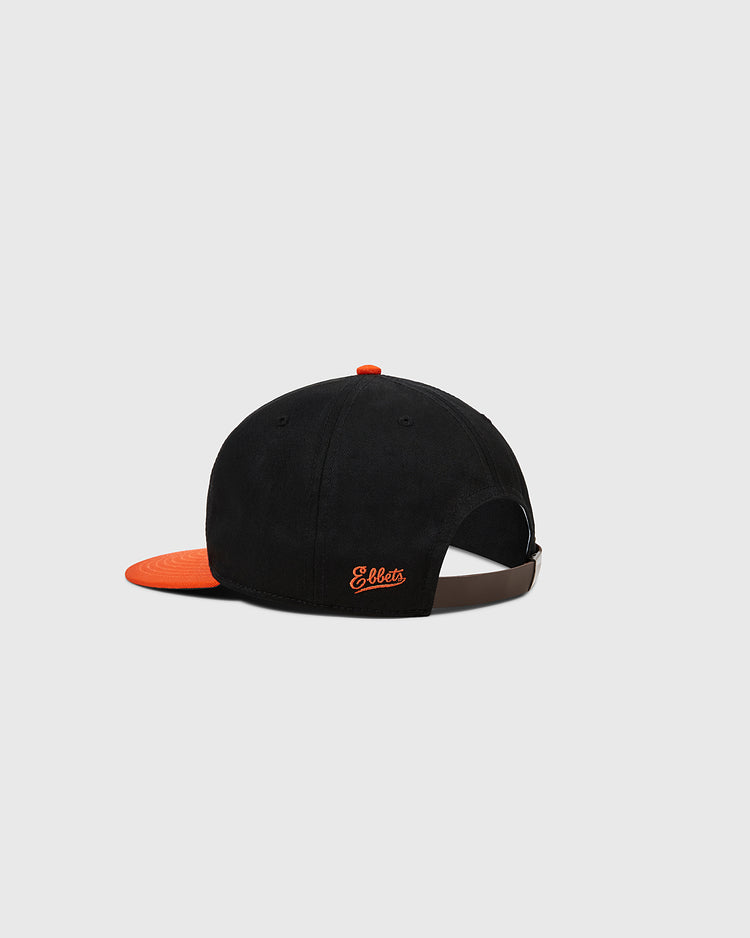 The Sioux City Ghosts Cotton Twill Ballcap by Ebbets Field is a vintage-style black cap with an orange brim and button, an adjustable back strap, and 