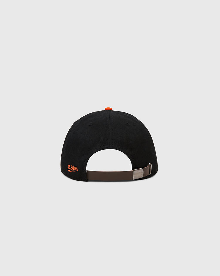The Ebbets Field Sioux City Ghosts Cotton Twill Ballcap is shown from the back, featuring an adjustable brown strap, a small orange Ghosts logo on the left side, and an orange top button, all set against a plain light background.