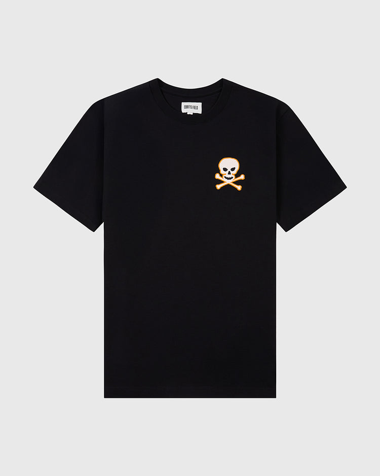 The Ebbets Field Sioux City Ghosts 'Skull and Bones' Short Sleeve Tee Shirt is black with a small white skull and crossbones on the left chest, inspired by fast-pitch softball. Vintage souvenir tee shown flat on a light gray background.