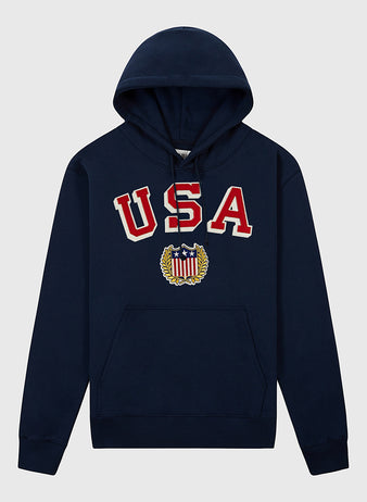 The Ebbets Field USA 1960 Miracle On Ice Heavyweight Cotton Terry Pullover Hoodie features bold red and white USA chest text and a star-spangled crest—ideal for fans of vintage hockey style.