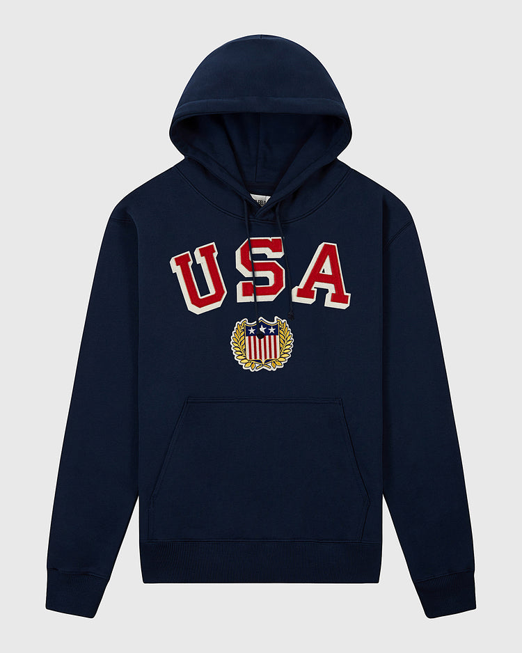 The Ebbets Field USA 1960 Miracle On Ice Heavyweight Cotton Terry Pullover Hoodie features bold red and white USA chest text and a star-spangled crest—ideal for fans of vintage hockey style.
