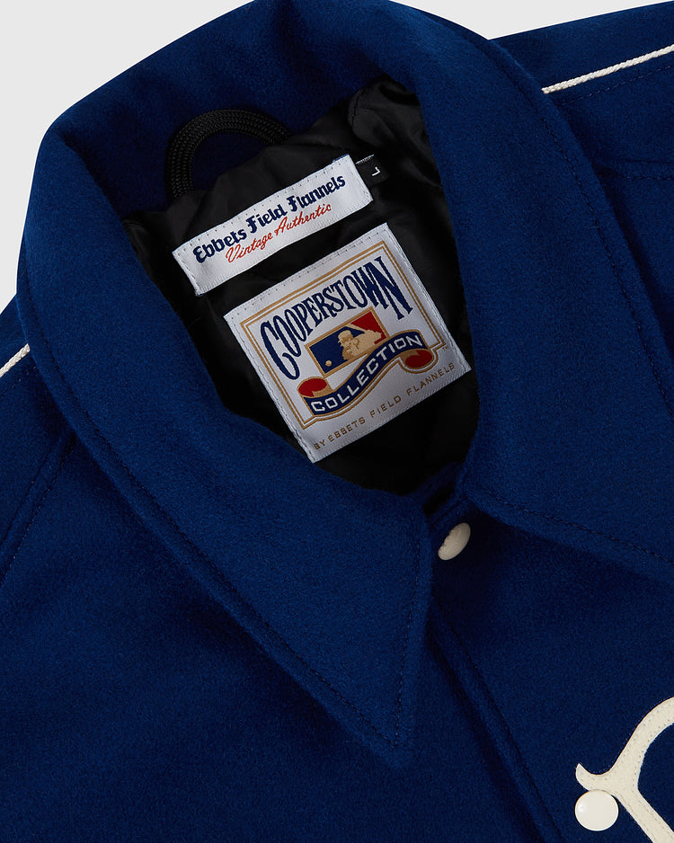 Close-up of the Jackie Robinson All Stars 1953 Authentic Jacket by EFF, highlighting its blue wool collar with “Ebbets Field Flannels Vintage Authentic” and “Cooperstown Collection” labels, plus white piping and buttons inspired by Brooklyn Dodgers style.