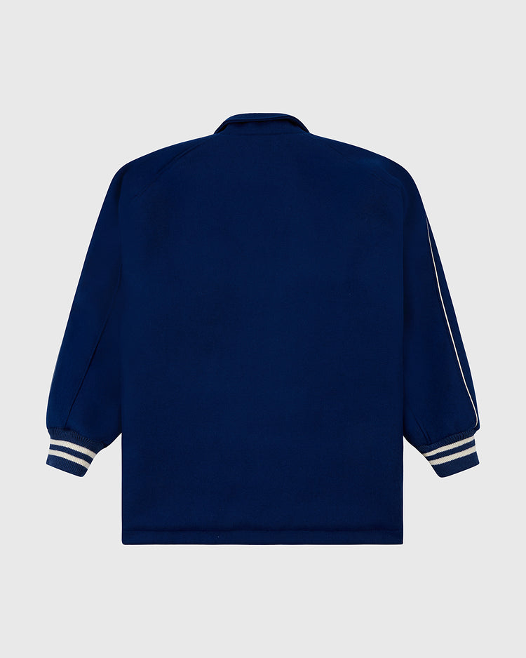 The EFF Jackie Robinson All Stars 1953 Authentic Jacket in navy wool features white and grey striped cuffs and sleeves, shown from the back on a plain light background. Inspired by the Brooklyn Dodgers.