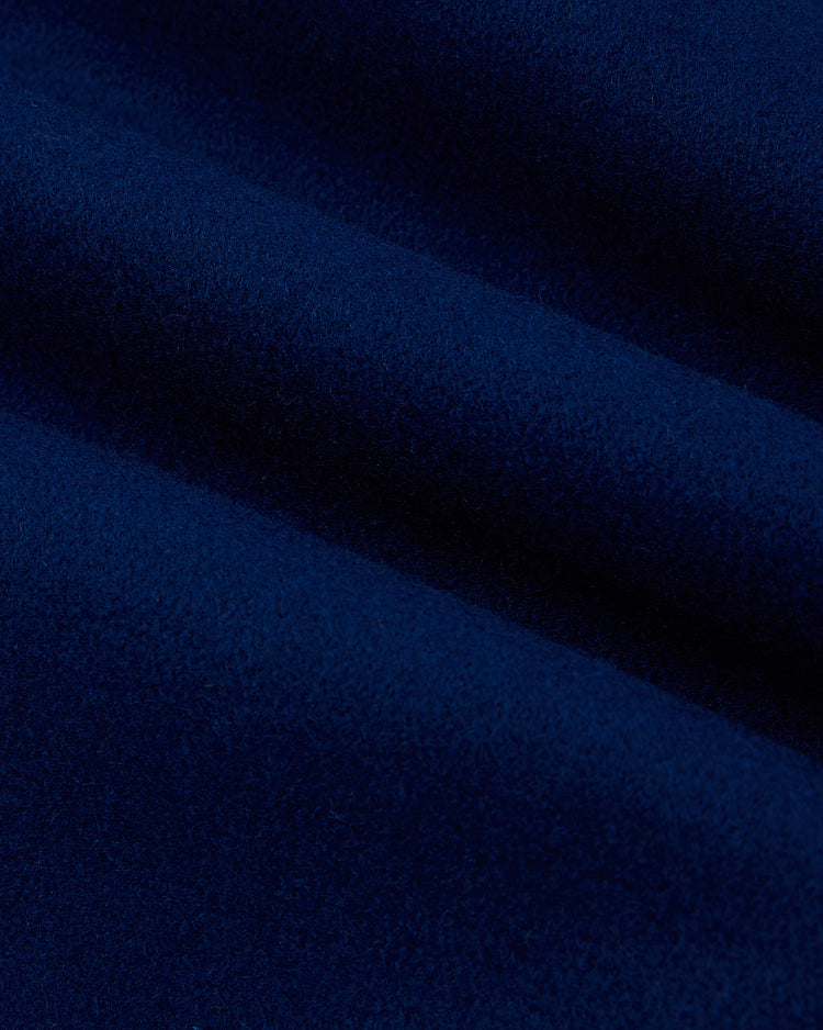 Close-up of the EFF Jackie Robinson All Stars 1953 Authentic Jacket in dark blue, featuring soft, velvety fabric with gentle folds and shadows, reminiscent of classic Brooklyn Dodgers wool styles.