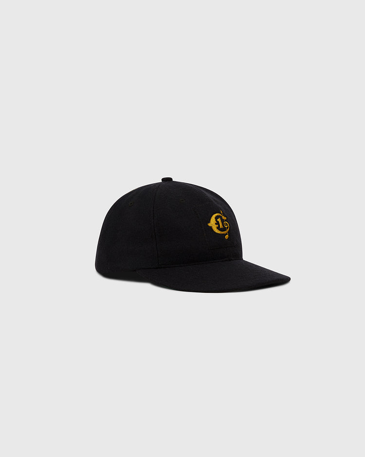 The Ebbets Field Tokyo Giants 1951 Authentic Wool Ballcap features a curved brim and a small yellow embroidered front logo, shown in black against a plain light gray background.
