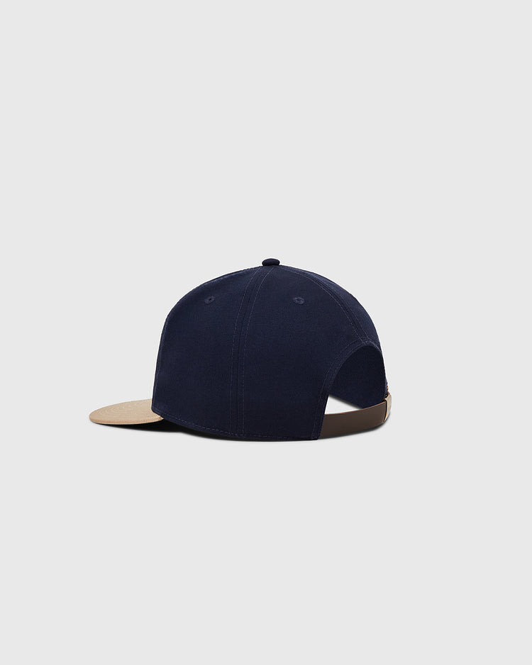 The Ebbets Field Mission Bears Cotton Twill Ballcap, shown from the back on a light gray background, features a navy crown, beige brim, adjustable strap, and visible stitching inspired by Bay Area baseball history.