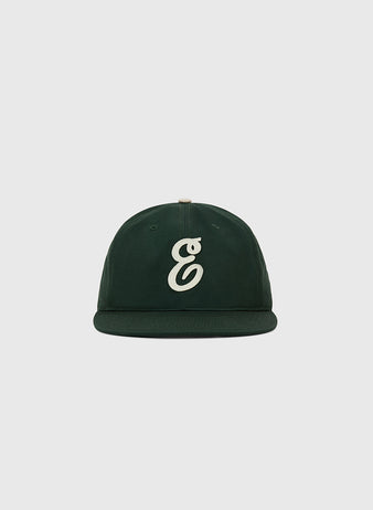 The Ebbets Field Ebbets Felt 'E' Cotton Twill Ballcap features a dark green cotton twill build and a white, stylized 'e' on the front, shown on a light gray background—ideal for everyday wear.