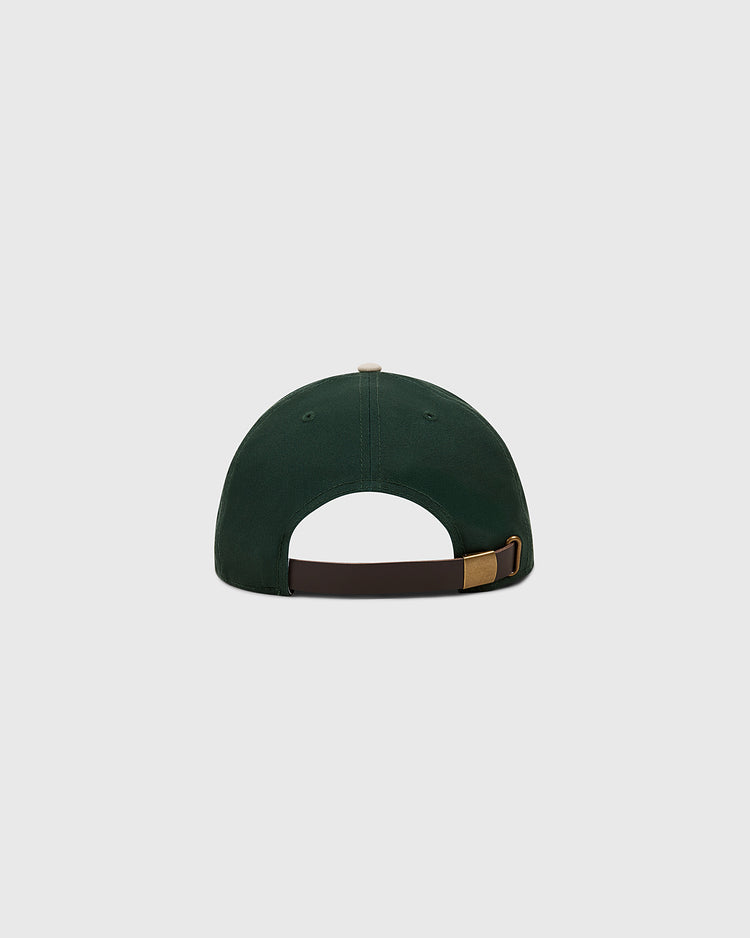 The Ebbets Field Ebbets Felt 'E' Cotton Twill Ballcap is shown from the back with a brown adjustable strap and gold buckle, crafted in dark green cotton twill, ideal for daily wear, set on a light gray backdrop.