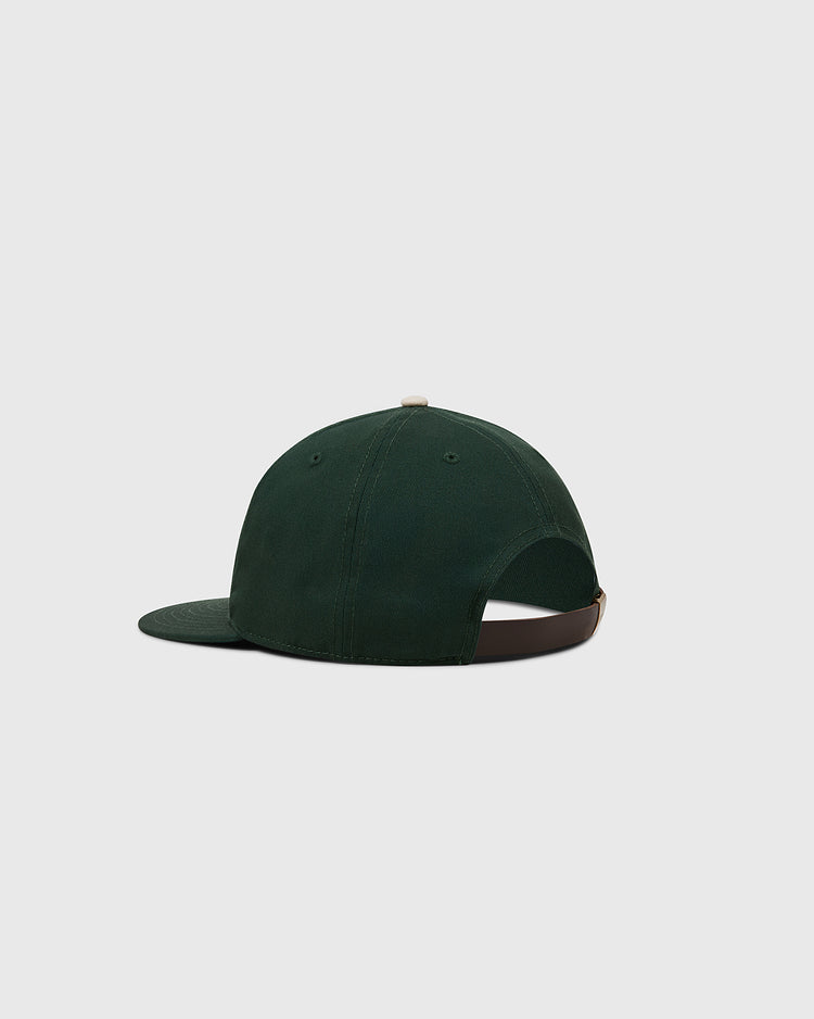 The Ebbets Field Ebbets Felt 'E' Cotton Twill Ballcap in dark green is shown from the back, with a curved brim and an open back featuring an adjustable brown strap, crafted in cotton twill and displayed against a light gray background.