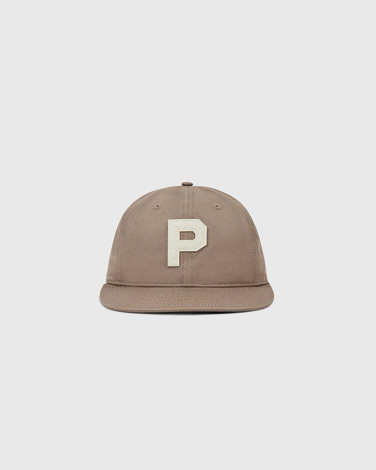 The Paris Red Peppers Cotton Twill Ballcap by Ebbets Field is a taupe baseball cap with a flat brim and a large, white letter P embroidered on the front, shown against a plain light grey background.