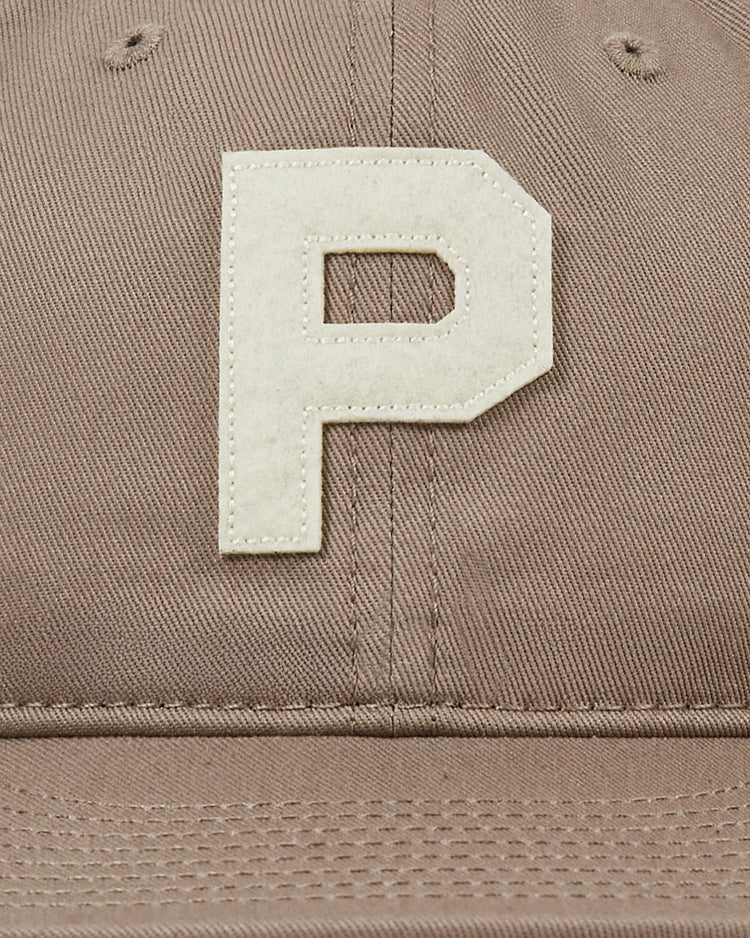Close-up of the Paris Red Peppers Cotton Twill Ballcap by Ebbets Field, showing a bold off-white 