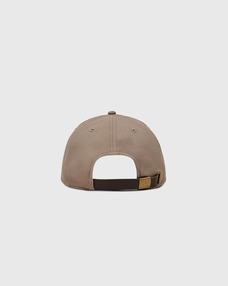 The Ebbets Field Paris Red Peppers Cotton Twill Ballcap is shown from the back, highlighting its adjustable brown strap with a gold buckle against a plain light gray background for a classic, vintage appeal.