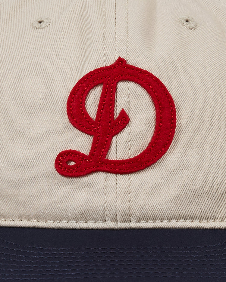 Close-up of the Detroit Stars Cotton Twill Ballcap by Ebbets Field, featuring a large red embroidered D on the front and a dark blue brim, inspired by the 1920 Detroit Stars’ Negro Leagues baseball legacy.