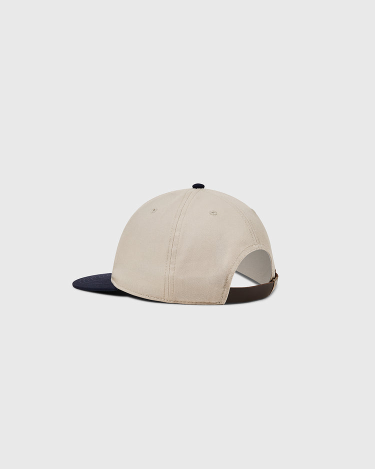 The Ebbets Field Detroit Stars Cotton Twill Ballcap features a beige crown, dark navy brim, adjustable brown strap, and stitched eyelets, shown from the back on a light gray background. Inspired by the 1920 Detroit Stars.