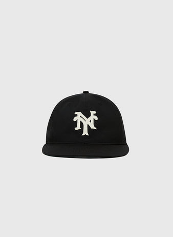 The Ebbets Field New York Cubans Cotton Twill Ballcap is a black flat-brim cap with a white NY logo, inspired by the legendary Negro League team, shown on a plain light gray background.